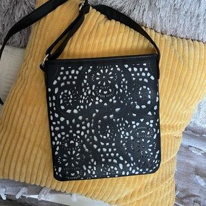 Stylish laser cut black faux leather crossbody! New!